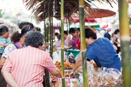 Bangkok, Thailand - October 20, 2013   Unidentified Thai people shopping at retro maket  with flower on October 20, 2013 のeditorial素材