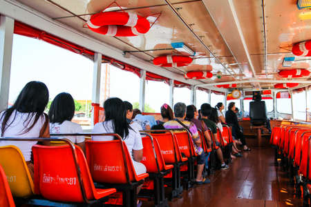 Bangkok, Thailand - November 3, 2013 : Unidentified people travelers are going by  express boat on the Chao Phraya River on November 3,, 2013 in Bangkok, Thailandのeditorial素材
