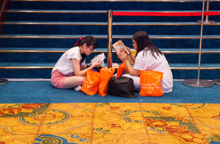 Bangkok, Thailand - October 18, 2013 : Unidentified reading a books on October 18, 2013 in Bangkok, Thailandのeditorial素材