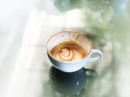 White coffee cup latte on the table.の素材