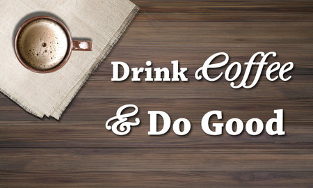 Drink coffee good. Coffee cup and napkin on wooden backgroundの写真素材