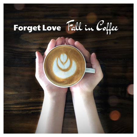 A cup of coffee in female hands with the text FORCE OF THE CLOSEの写真素材