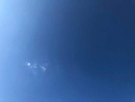 blue sky background with tiny clouds, soft focus, and copy spaceの写真素材