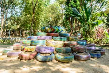 photo of old tyre, paint and reuse in the parkの写真素材