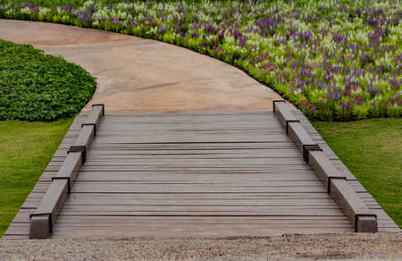 Curve footpath with wood bridgeの写真素材