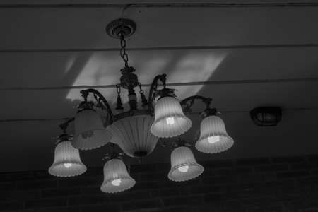 Chandelier on the ceiling of the house in silhouette color.の写真素材