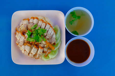 Crispy Pork Rice with gravy with clear soup is very famous street food in the morning.の写真素材