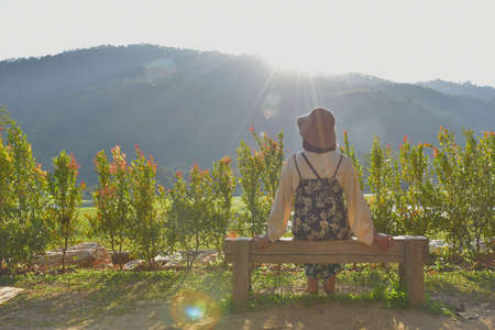 Be hind happy girl. She  looking  beautiful view.の写真素材