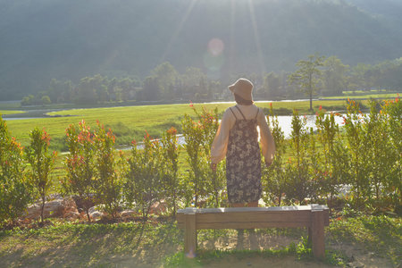 Be hind happy girl. She  looking  beautiful view.の写真素材