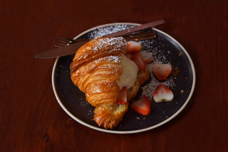 Very sweet dessert croissant ice cream and stawberry slite is nice time in holiday.
