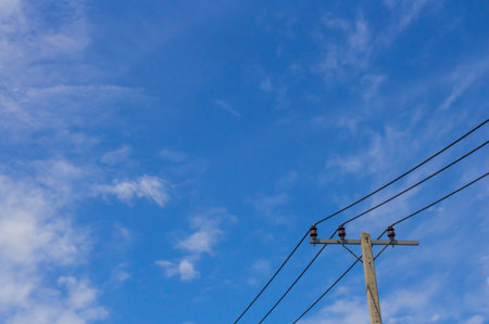Electricity post on blue skyの写真素材