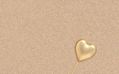 Golden heart shape figure on right on shiny yellow golden background with sparkles and bokehの写真素材