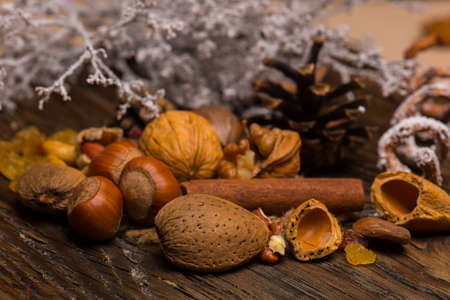 Dried raisins and nuts on natural woodの写真素材