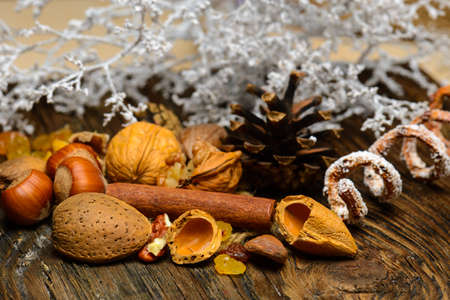 Dried raisins and nuts on natural woodの写真素材