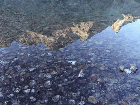 Mountain Peak Reflected in Waterの写真素材