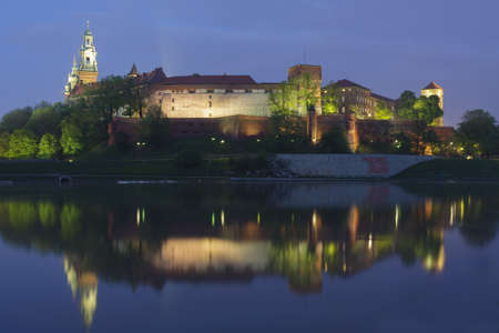 Poland, Krakow, Wawel Royal Castle Lit-up, spring, evening, seen from the westの写真素材