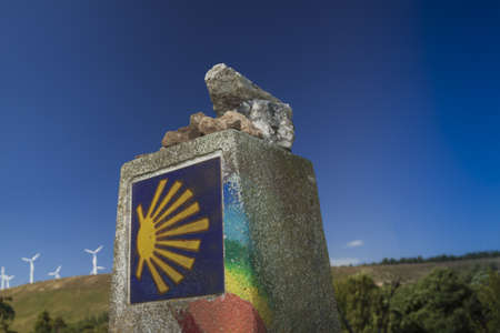 Spain, Galicia, rainbow painted milestone at the Camino de Santiagoの写真素材