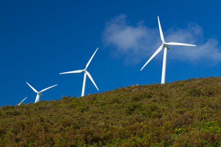 Spain, Asturias,  wind turbines on a hill, clouds