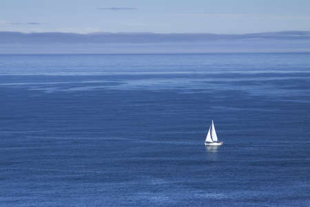 Spain, Galicia, Muxia, sail boat at sea, Atlantic Oceanの写真素材