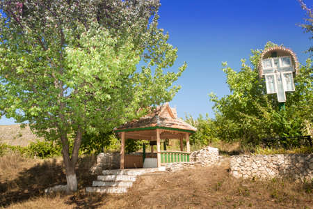 Republic of Moldova, Orhei Vechi, Orheiul Vechi nature reservation, village of Butuceni, a well and a wayside shrineの写真素材