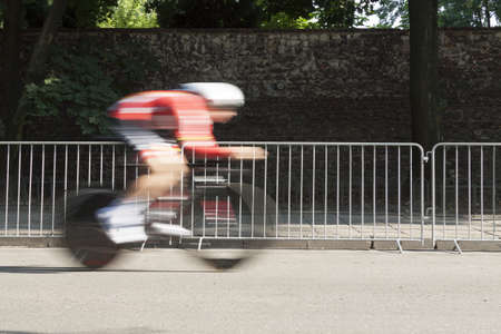 Individual Time Trial Cyclist on a Street, motion blurの写真素材