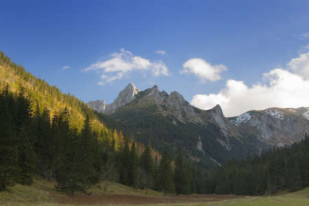Sunlit Giewont peak in Tatry Zachodnie (west Tatras), Poland, autumnの写真素材