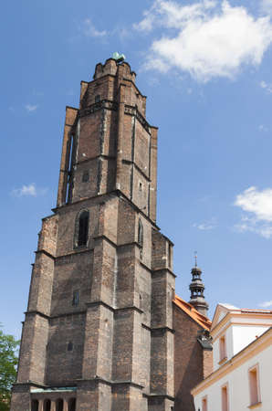 Poland, Silesia, Gliwice,All Saints church tower seen from south-east, sunlit, cluouds in the skyの写真素材