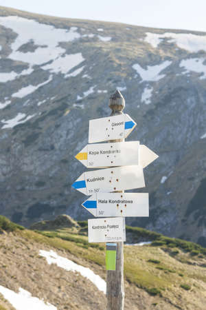 Poland, Signpost at Kondracka PrzeÅÄcz, reamins of snowのeditorial素材