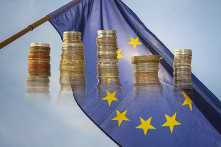 Flag of European Union, sun shining throuhg, sky in the backgroundの写真素材