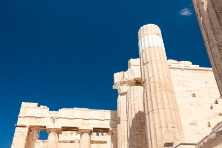 Greece, Athens, Acropolis, columns of Propylaea, sunlit, against blue skyの写真素材