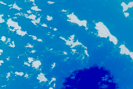 White, blue and cyan background texture. Abstract map with north shoreline, sea, ocean, ice, mountains, clouds. View from height of the bird's flight. The surface of fantasy planet.の写真素材