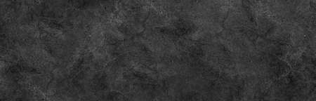 Dark black gray background marbled stone wall or rock industrial texture in website banner header backdrop designの写真素材