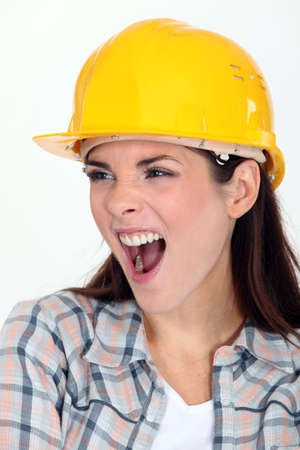 Female builder shoutingの写真素材