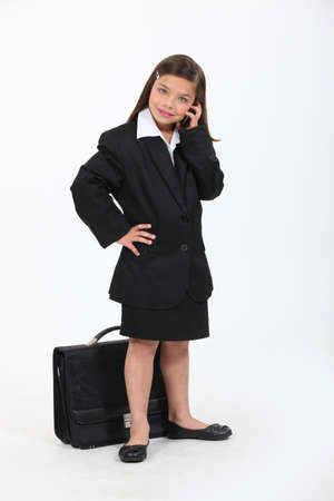 little girl dressed as a businesswomanの写真素材