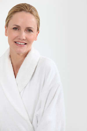 Woman in bath robeの写真素材