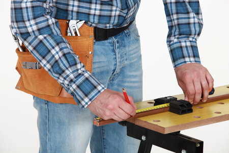 craftsman taking measurements