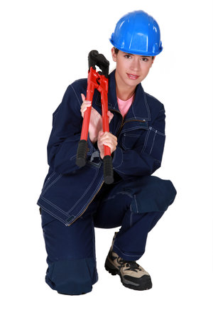 craftswoman holding a spanner