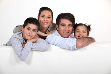 Young family with a board left blank for your imageの写真素材