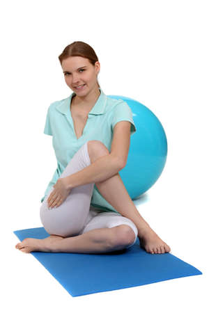 woman doing stretching exerciseの写真素材