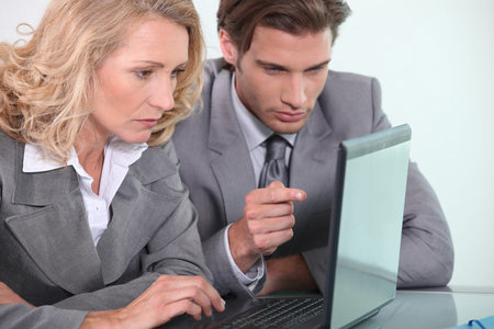 businessman and woman with laptop