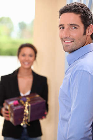 woman receiving gift from boyfriendの写真素材