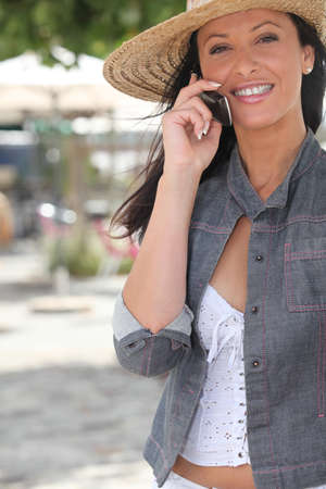 Attractive woman talking on her mobile phoneの写真素材
