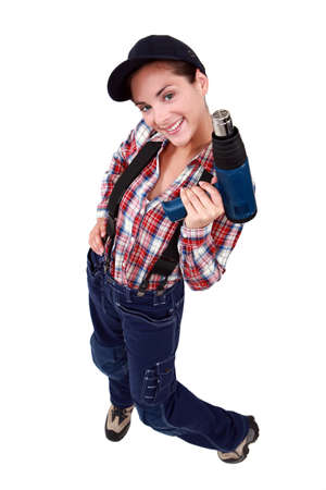 sexy craftswoman holding a drillの写真素材