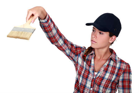 craftswoman holding a brushの写真素材