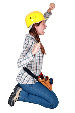 craftswoman kneeling and stretchingの写真素材