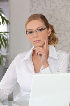 Smart young woman at a laptop computerの写真素材