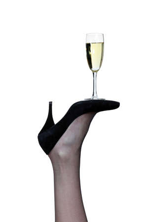 flute of champagne posed on sole of pumpの写真素材