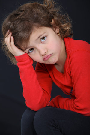 Little girl sulking.