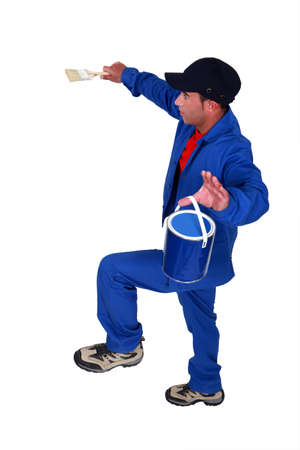 Painter walking an imaginary tightropeの写真素材