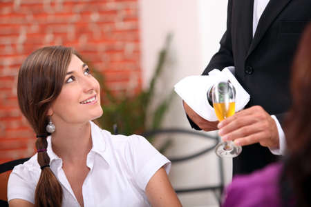 Waiter pouring champagneの写真素材